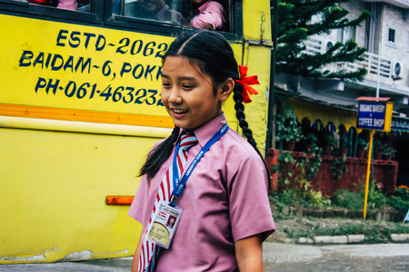 Pokhara Nepal October 4, 2018 Portrait of children coming from the school in a traditional Nepalese...