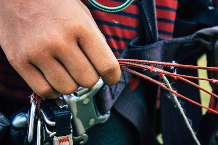 Pokhara Nepal October 6, 2018 Portrait of a young Nepali kid learning to be a paragliding pilot in the landing area front the Phewa lake of Pokharaのeditorial素材