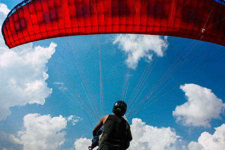 Pokhara Nepal October 6, 2018 View of a paragliding pilot landing front the Phewa lake of Pokharaのeditorial素材