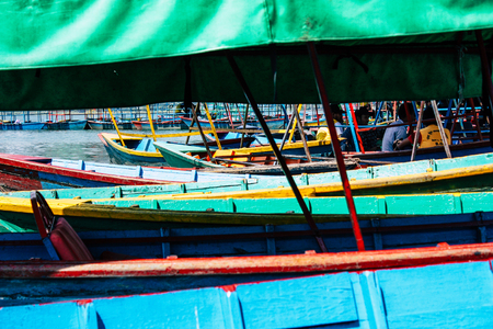 Pokhara Nepal October 9, 2018 View of colorful and traditional Nepalese boats at the Phewa lake of Pokhara in the morningのeditorial素材