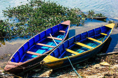 Pokhara Nepal October 9, 2018 View of colorful and traditional Nepalese boats at the Phewa lake of Pokhara in the morningのeditorial素材