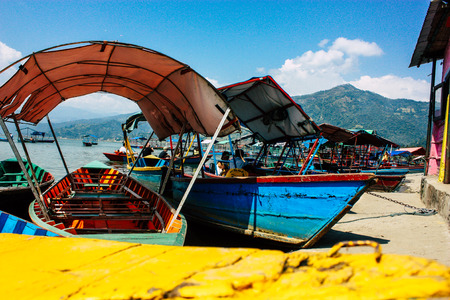 Pokhara Nepal October 9, 2018 View of colorful and traditional Nepalese boats at the Phewa lake of Pokhara in the morningのeditorial素材