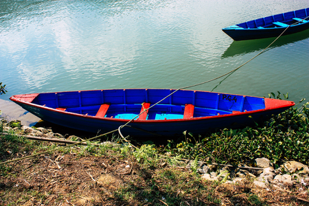 Pokhara Nepal October 9, 2018 View of colorful and traditional Nepalese boats at the Phewa lake of Pokhara in the morningのeditorial素材