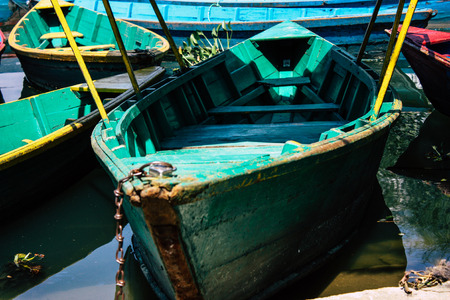 Pokhara Nepal October 9, 2018 View of colorful and traditional Nepalese boats at the Phewa lake of Pokhara in the morningのeditorial素材