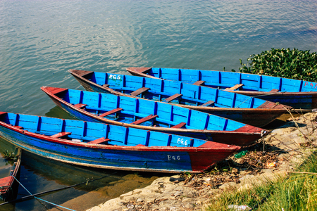 Pokhara Nepal October 9, 2018 View of colorful and traditional Nepalese boats at the Phewa lake of Pokhara in the morningのeditorial素材