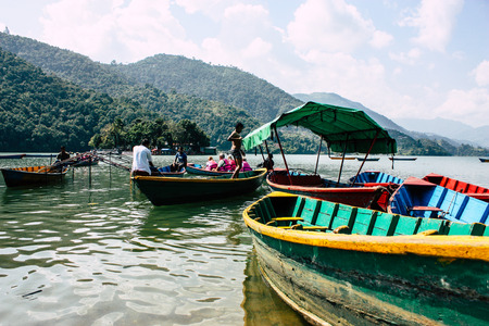 Pokhara Nepal October 9, 2018 View of colorful and traditional Nepalese boats at the Phewa lake of Pokhara in the morningのeditorial素材