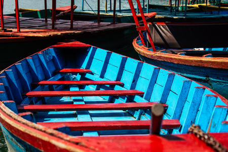 Pokhara Nepal October 9, 2018 View of colorful and traditional Nepalese boats at the Phewa lake of Pokhara in the morningのeditorial素材