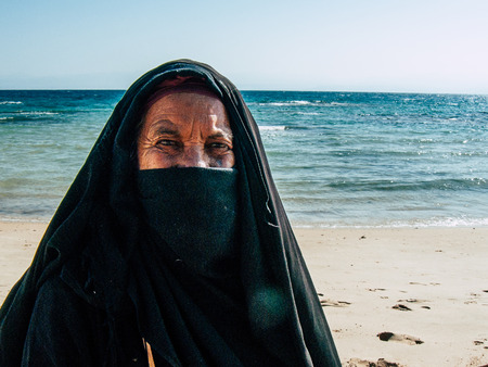 Sinai Egypt October 6, 2018 Portrait of an Arabian woman selling handmade jewelry on the beach in the morningのeditorial素材
