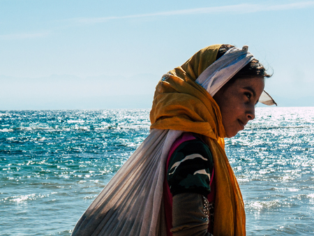Sinai Egypt October 6, 2018 Portrait of a young Arabian teen walking on the beach in the morningのeditorial素材
