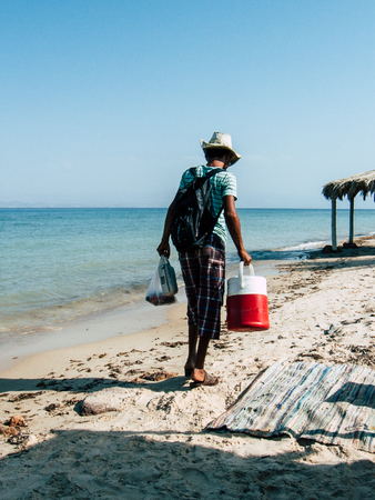 Sinai Egypt October 6, 2018 Portrait of a unknown Arabian man selling ice cream on the beach of Sinai in the morningのeditorial素材