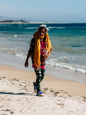 Sinai Egypt October 6, 2018 Portrait of a young Arabian teen walking on the beach in the morningのeditorial素材
