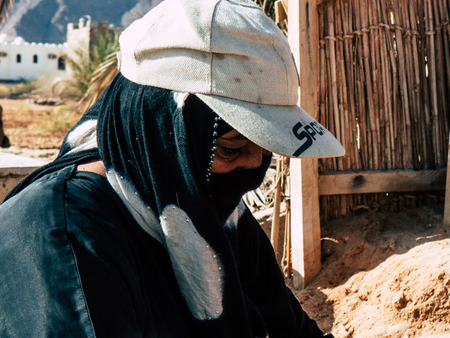Sinai Egypt October 6, 2018 Portrait of an Arabian woman selling handmade jewelry on the beach in the morningのeditorial素材