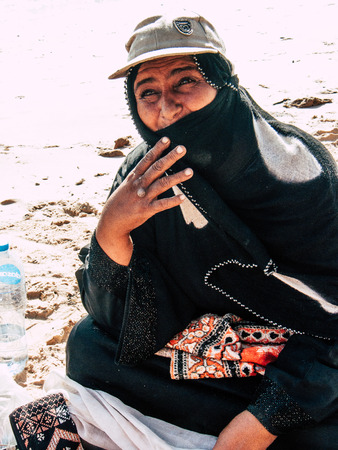 Sinai Egypt October 6, 2018 Portrait of an Arabian woman selling handmade jewelry on the beach in the morningのeditorial素材