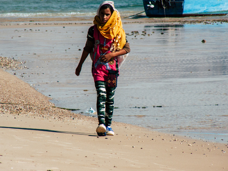 Sinai Egypt October 6, 2018 Portrait of a young Arabian teen walking on the beach in the morningのeditorial素材