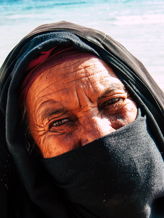 Sinai Egypt October 6, 2018 Portrait of an Arabian woman selling handmade jewelry on the beach in the morningのeditorial素材