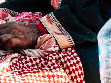 Sinai Egypt October 6, 2018 Closeup of the hand of an Arabian woman selling handmade jewelry on the beach in the morningのeditorial素材