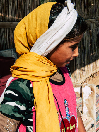 Sinai Egypt October 6, 2018 Portrait of a young Arabian teen walking on the beach in the morningのeditorial素材