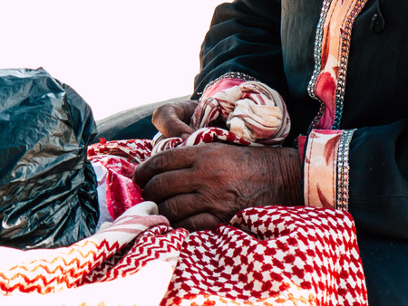 Sinai Egypt October 6, 2018 Closeup of the hand of an Arabian woman selling handmade jewelry on the beach in the morningのeditorial素材