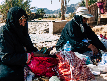 Sinai Egypt October 6, 2018 Portrait of an Arabian woman selling handmade jewelry on the beach in the morningのeditorial素材
