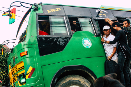 Pokhara Nepal October 12, 2018 View of a traditional Nepali local bus driving in New street at pokhara in the afternoonのeditorial素材