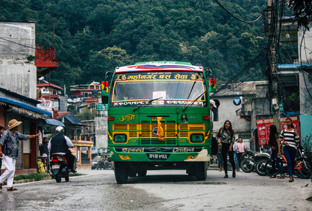 Pokhara Nepal October 12, 2018 View of a traditional Nepali local bus driving in New street at pokhara in the afternoonのeditorial素材