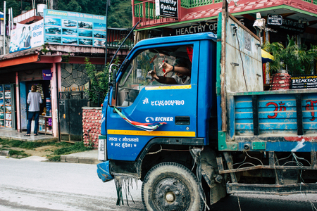 Pokhara Nepal October 12, 2018 View of a traditional Nepali local truck driving in New street at pokhara in the afternoonのeditorial素材