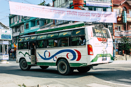Pokhara Nepal October 12, 2018 View of a traditional Nepali local bus driving in New street at pokhara in the afternoonのeditorial素材