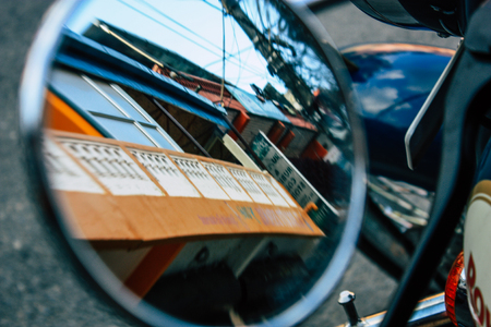 View of a Royal Enfield Motorcycle parked in the main street of Pokhara in the afternoonの写真素材