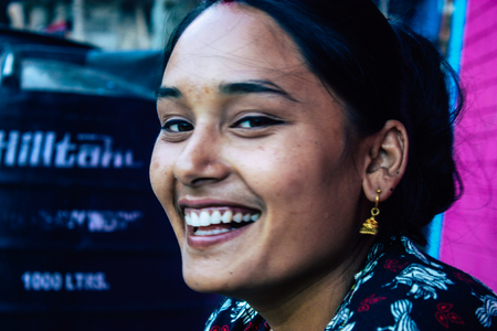 Bandipur Nepal October  15, 2018 Closeup of young woman seating front her house in a side street of Bandipur in the afternoonのeditorial素材