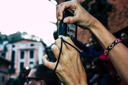 Bandipur Nepal October 18, 2018 Closeup of unknown people taking photo during a religious ceremony...