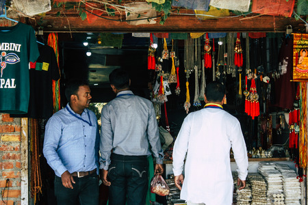 Lumbini Nepal October 31, 2018 Closeup of unknowns pilgrims shopping in a souvenirs shop located at...