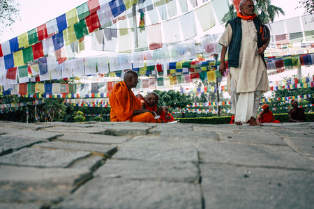 Lumbini Nepal November 2, 2018 View of Saddhu praying under the holy tree at the Sacred Buddha garden in Lumbini in the afternoonのeditorial素材