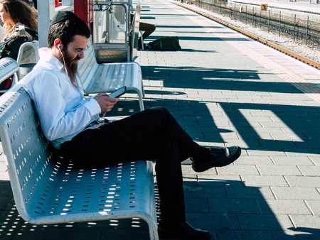 Tel Aviv Israel November 3, 2018  View of unknown Israeli passenger traveling by train at the Tel Aviv University train station in the afternoonのeditorial素材