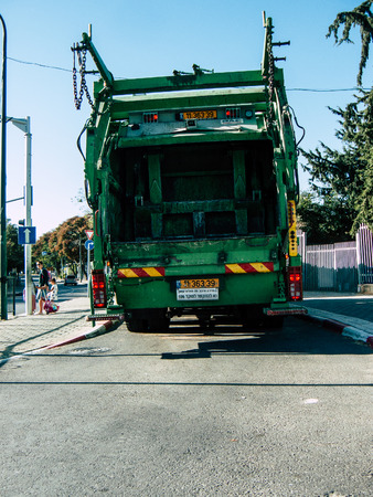 Tel Aviv Israel October 25, 2018  View of a green garbage truck parked in the streets of Tel Aviv in the afternoonのeditorial素材