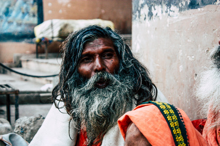 Varanasi India November 8, 2018 Sadhu sitting and smoking the shillum front the Ganges river in the...
