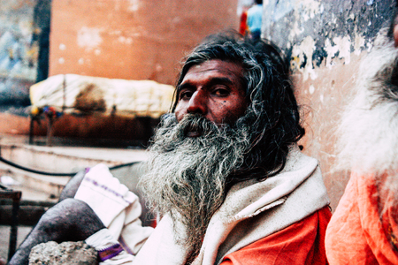 Varanasi India November 8, 2018 Sadhu sitting and smoking the shillum front the Ganges river in the afternoonのeditorial素材