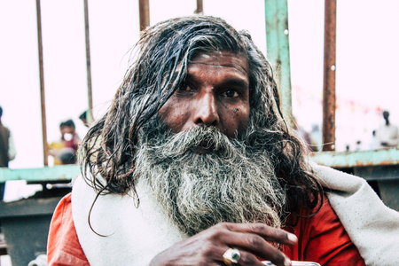 Varanasi India November 8, 2018 Sadhu sitting and smoking the shillum front the Ganges river in the afternoonのeditorial素材