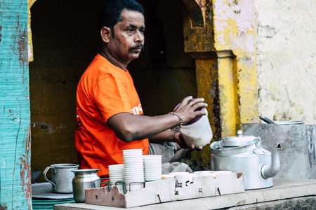 Varanasi India November 10, 2018 View of a unknown people selling chai in a small tea shop in the Ghats of Varanasi in the afternoonのeditorial素材