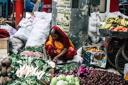 Varanasi India November 11, 2018 View of unknown Indian seller at the vegetables market located in the street front the entry of the Dashashwamedh ghat in the morningのeditorial素材