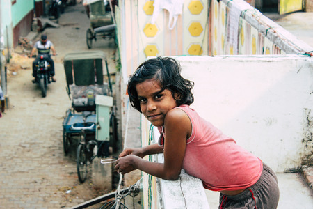 Varanasi India November 11, 2018 Portrait of a young Indian girl having fun in the streets of Varanasi in the afternoonのeditorial素材