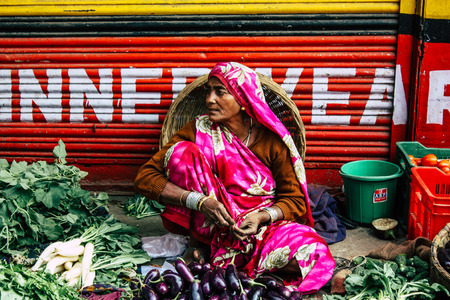 Varanasi India November 11, 2018 View of unknown Indian seller at the vegetables market located in the street front the entry of the Dashashwamedh ghat in the morningのeditorial素材