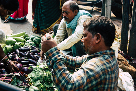Varanasi India November 11, 2018 View of unknown Indian seller at the vegetables market located in the street front the entry of the Dashashwamedh ghat in the morningのeditorial素材