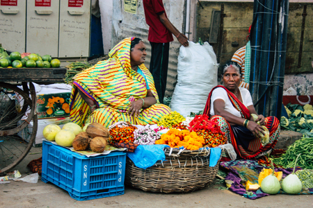 Varanasi India November 11, 2018 View of unknown Indian seller at the vegetables market located in the street front the entry of the Dashashwamedh ghat in the morningのeditorial素材