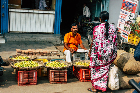 Varanasi India November 11, 2018 View of unknown Indian seller at the vegetables market located in the street front the entry of the Dashashwamedh ghat in the morningのeditorial素材