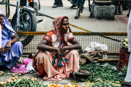 Varanasi India November 11, 2018 View of unknown Indian seller at the vegetables market located in the street front the entry of the Dashashwamedh ghat in the morningのeditorial素材