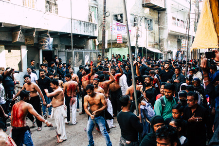 Varanasi India November 17, 2018 View of unknowns Shiite  Muslims use chains and blades during ritual self flagellation as part of the Imam Husain celebration, Ashura commemorations in the Arabian district of Varanasi in the morningのeditorial素材
