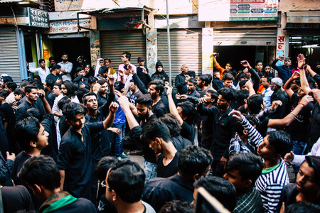 Varanasi India November 17, 2018 View of unknowns Shiite Muslims take part in a procession as part of the Ashura commemorations in the Arabian district of Varanasi  in the morningのeditorial素材