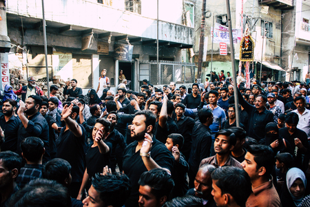 Varanasi India November 17, 2018 View of unknowns Shiite Muslims take part in a procession as part of the Ashura commemorations in the Arabian district of Varanasi  in the morningのeditorial素材