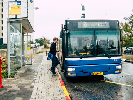 Tel Aviv Israel November 23, 2018 View of unknown Israeli people at the bus stand in the streets of Tel Aviv in the afternoonのeditorial素材