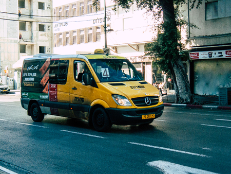 Tel Aviv Israel October 23, 2018  View of a traditional Israeli yellow taxi rolling in the street of...